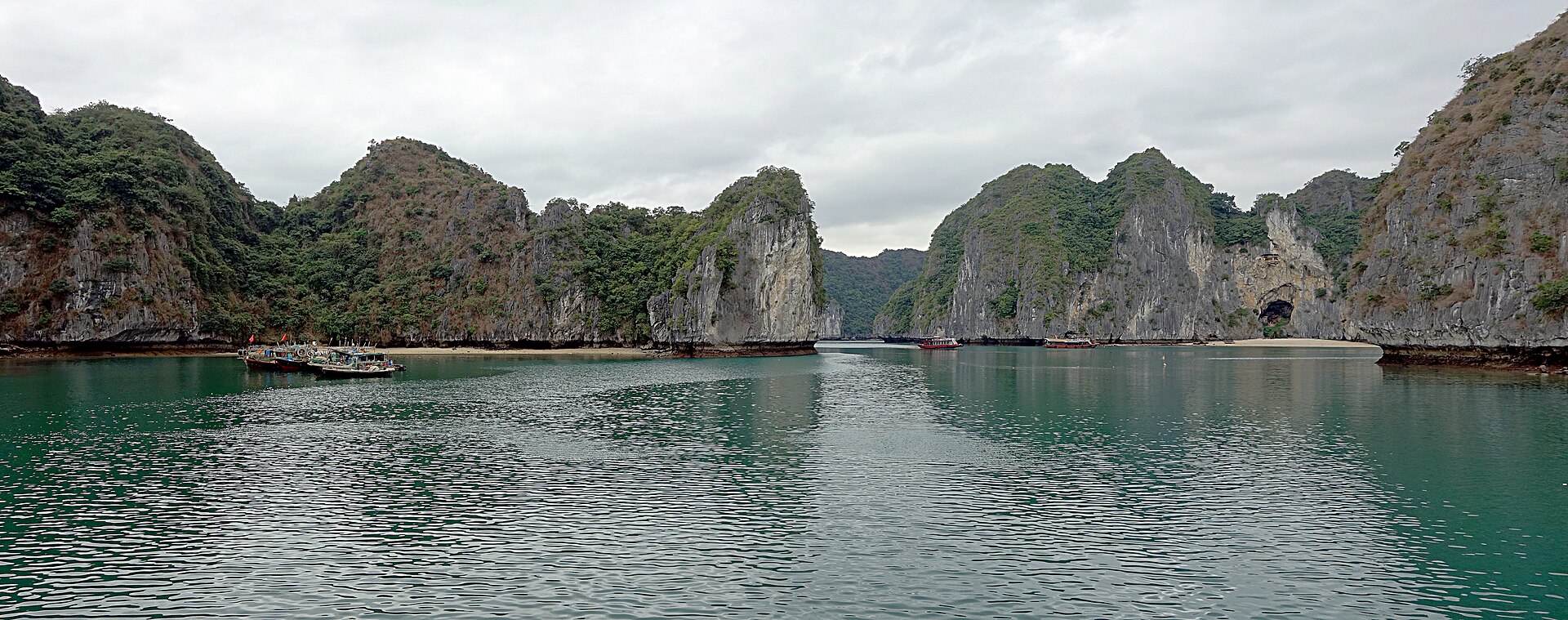 Panorama of Lan Ha Bay — limestone karst islands rising from calm water